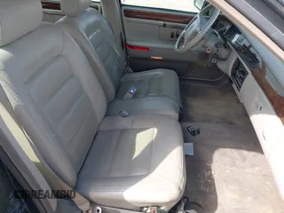1995 Cadillac Concours z VIN 1G6KF52YXSU302434, wystawiony jako IAAI lot #42231281 z przebiegiem 153 236 mil mil oraz . Historia ofert i sprzedaży dostępna na DreamBid. Obrazek 5.