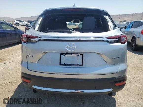2021 Mazda CX-9 Grand Touring z VIN JM3TCADY4M0512268, wystawiony jako Copart lot #62683464 z przebiegiem Nie podano mil oraz Szkoda całkowita • Salvage title. Historia ofert i sprzedaży dostępna na DreamBid. Obrazek 6.