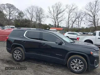 2021 GMC Acadia SLT with VIN 1GKKNMLS0MZ209789, listed as a IAAI auction lot 41521978 with 104,690 mi miles. Bid and sale history available at carsss.com. Image 13.