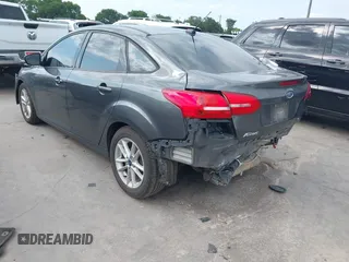 2018 Ford Focus SE with VIN 1FADP3F22JL295342, listed as a IAAI auction lot 42335881 with 77,464 mi miles and . Bid and sale history available at DreamBid. Image 3.