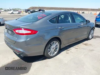 2014 Ford Fusion SE Hybrid with VIN 3FA6P0LU5ER393530, listed as a IAAI auction lot 42478440 with 93,728 mi miles and . Bid and sale history available at DreamBid. Image 4.