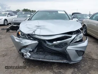 2018 Toyota Camry LE z VIN 4T1B11HK3JU129549, wystawiony jako IAAI lot #42159243 z przebiegiem 76 299 mil mil oraz . Historia ofert i sprzedaży dostępna na DreamBid. Obrazek 13.