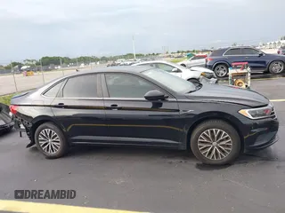 2019 Volkswagen Jetta SEL z VIN 3VWEB7BU2KM273950, wystawiony jako IAAI lot #42414034 z przebiegiem 84 100 mil mil oraz . Historia ofert i sprzedaży dostępna na DreamBid. Obrazek 13.