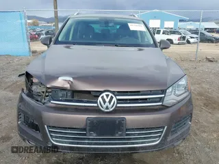 2013 Volkswagen Touareg Lux with VIN WVGEF9BP1DD012851, listed as a IAAI auction lot 41732391 with 123,283 mi miles and . Bid and sale history available at DreamBid. Image 13.