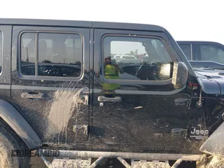 2020 Jeep Wrangler Unlimited Sport S with VIN 1C4HJXDN2LW165046, listed as a IAAI auction lot 42400876 with 92,100 mi miles and . Bid and sale history available at DreamBid. Image 13.