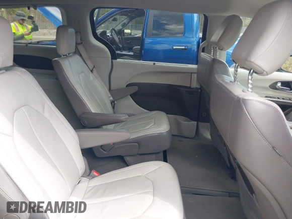 2017 Chrysler Pacifica Touring L with VIN 2C4RC1BGXHR667397, listed as a IAAI auction lot 42085117 with 63,996 mi miles and . Bid and sale history available at DreamBid. Image 8.