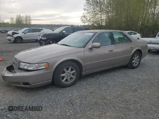 2000 Cadillac Seville Touring STS z VIN 1G6KY5497YU350398, wystawiony jako Copart lot #51636715 z przebiegiem 116 707 mil mil oraz Szkody całkowita. Historia ofert i sprzedaży dostępna na DreamBid. Obrazek 1.