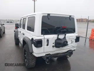 2023 Jeep Wrangler Sport with VIN 1C4HJXDN8PW523532, listed as a IAAI auction lot 41962483 with 14,643 mi miles and . Bid and sale history available at DreamBid. Image 6.