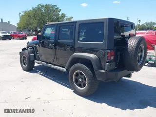 2013 Jeep Wrangler Unlimited Sport with VIN 1C4BJWDG7DL583686, listed as a IAAI auction lot 42037650 with 122,408 mi miles. Bid and sale history available at carsss.com. Image 3.