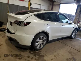 2022 Tesla Model Y Long Range z VIN 7SAYGDEEXNA012904, wystawiony jako Copart lot #57492865 z przebiegiem 31 294 mil mil oraz Szkody całkowita. Historia ofert i sprzedaży dostępna na DreamBid. Obrazek 3.