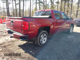 2018 Chevrolet Silverado 1500 LT with VIN 3GCUKREC4JG204672, listed as a IAAI auction lot 41638941 with 134,506 mi miles. Bid and sale history available at carsss.com. Image 4.