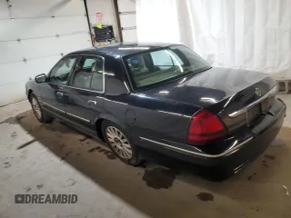 2010 Mercury Grand Marquis LS z VIN 2MEBM7FV6AX628705, wystawiony jako Copart lot #52185105 z przebiegiem 139 485 mil mil oraz Szkody całkowita. Historia ofert i sprzedaży dostępna na DreamBid. Obrazek 2.