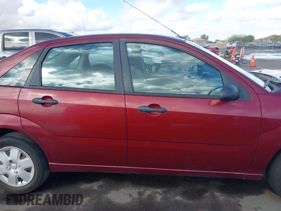 2007 Ford Focus S z VIN 1FAHP34NX7W114297, wystawiony jako IAAI lot #41774573 z przebiegiem 111 079 mil mil oraz . Historia ofert i sprzedaży dostępna na DreamBid. Obrazek 14.