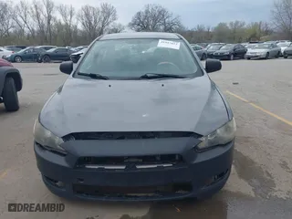 2010 Mitsubishi Lancer DE with VIN JA32U1FU7AU005962, listed as a IAAI auction lot 41927652 with 218,829 mi miles. Bid and sale history available at carsss.com. Image 6.