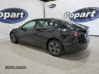 2023 Tesla Model 3 with VIN 5YJ3E1EA4PF452809, listed as a Copart auction lot 63688885 with 125,442 mi miles and Clean title. Bid and sale history available at DreamBid. Image 2.