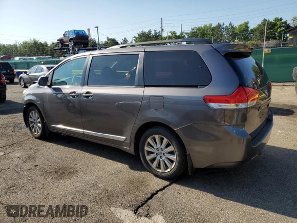 2014 Toyota Sienna Limited with VIN 5TDDK3DC8ES078175, listed as a Copart auction lot 61138585 with 98,527 mi miles and Salvage title. Bid and sale history available at DreamBid. Image 2.