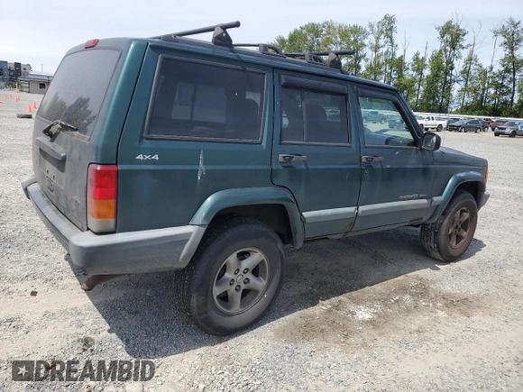 1999 Jeep Cherokee Sport with VIN 1J4FF68S2XL570795, listed as a Copart auction lot 61860585 with 320,467 mi miles and Salvage title. Bid and sale history available at DreamBid. Image 3.