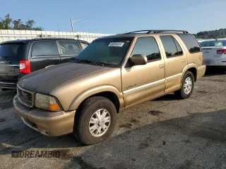 1999 GMC Jimmy SLE z VIN 1GKDT13W3X2951794, wystawiony jako Copart lot #86254964 z przebiegiem Nie podano mil oraz Szkoda całkowita • Salvage title. Historia ofert i sprzedaży dostępna na DreamBid. Obrazek 1.