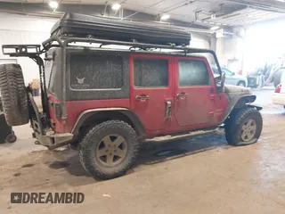 2011 Jeep Wrangler Unlimited Sport with VIN 1J4HA3H1XBL534312, listed as a IAAI auction lot 41030703 with 1 mi miles. Bid and sale history available at carsss.com. Image 4.