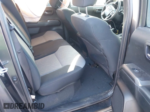 2023 Toyota Tacoma SR with VIN 3TMCZ5AN2PM553928, listed as a IAAI auction lot 40999044 with 9,210 mi miles and . Bid and sale history available at DreamBid. Image 8.