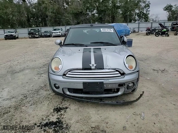 2009 MINI Cooper Convertible with VIN WMWMR33579TU95581, listed as a Copart auction lot 45914735 with 129,790 mi miles and Salvage Title. Bid and sale history available at carsss.com. Image 11.