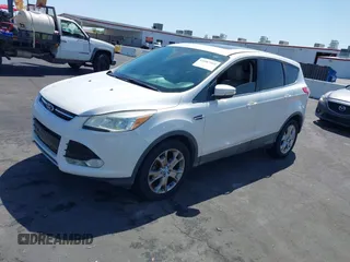 2013 Ford Escape SEL with VIN 1FMCU0HX1DUB99590, listed as a IAAI auction lot 41987910 with 129,954 mi miles. Bid and sale history available at carsss.com. Image 2.