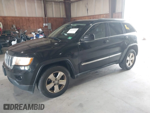 2012 Jeep Grand Cherokee Laredo with VIN 1C4RJFAT8CC182128, listed as a IAAI auction lot 40154044 with 239,601 mi miles. Bid and sale history available at carsss.com. Image 2.