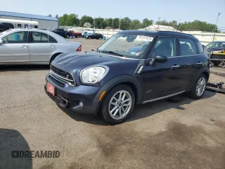 2015 MINI Countryman S with VIN WMWZC5C54FWP48739, listed as a Copart auction lot 58197575 with 119,816 mi miles and Salvage title. Bid and sale history available at DreamBid. Image 1.
