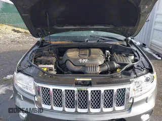 2013 Jeep Grand Cherokee Overland with VIN 1C4RJFCG8DC581719, listed as a IAAI auction lot 41566666 with 152,332 mi miles. Bid and sale history available at carsss.com. Image 10.
