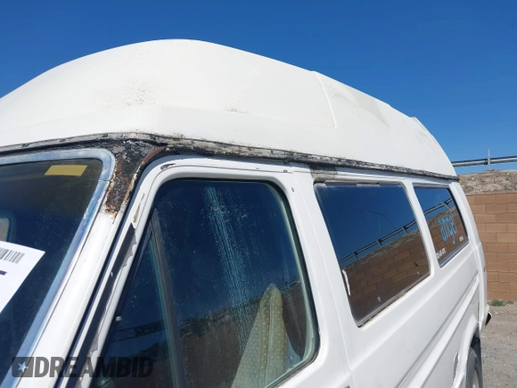 1985 Ford Econoline Cargo with VIN 1FBHS31L3FHA83624, listed as a IAAI auction lot 41987555 with 2,242 mi miles and . Bid and sale history available at DreamBid. Image 12.