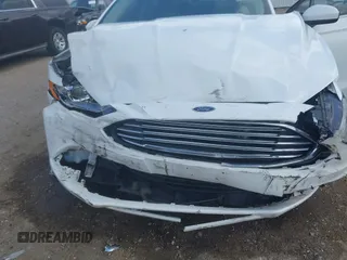 2018 Ford Fusion S z VIN 3FA6P0G71JR166706, wystawiony jako IAAI lot #42275722 z przebiegiem 33 752 mil mil oraz . Historia ofert i sprzedaży dostępna na DreamBid. Obrazek 6.