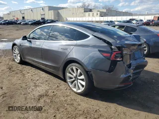 2019 Tesla Model 3 Mid Range with VIN 5YJ3E1EA6KF312754, listed as a Copart auction lot 50403855 with 148,217 mi miles and Salvage Title. Bid and sale history available at carsss.com. Image 2.