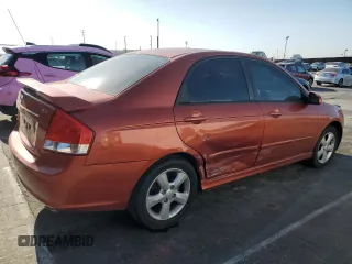 2009 Kia Spectra EX with VIN KNAFE222995027376, listed as a Copart auction lot 52406025 with 73,692 mi miles and Salvage Title. Bid and sale history available at DreamBid. Image 3.