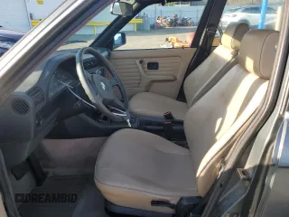 1989 BMW 3 Series 325i with VIN WBAAD2307K8849902, listed as a Copart auction lot 87257434 with 233,562 mi miles and Salvage Title. Bid and sale history available at carsss.com. Image 7.