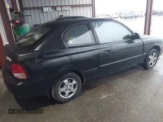 2001 Hyundai Accent GL with VIN KMHCG35C81U090873, listed as a IAAI auction lot 41436739 with 59,359 mi miles. Bid and sale history available at carsss.com. Image 4.