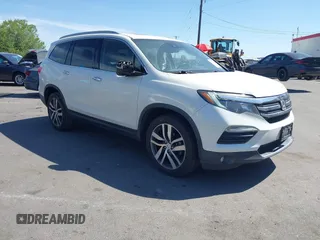 2017 Honda Pilot Touring with VIN 5FNYF6H93HB021848, listed as a IAAI auction lot 42316884 with 132,464 mi miles and . Bid and sale history available at DreamBid. Image 1.