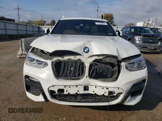 2019 BMW X4 xDrive30i with VIN 5UXUJ3C5XKLG54286, listed as a Copart auction lot 77333284 with 99,771 mi miles and Salvage Title. Bid and sale history available at carsss.com. Image 5.