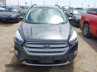 2018 Ford Escape SE z VIN 1FMCU9G98JUC13620, wystawiony jako IAAI lot #42011272 z przebiegiem 71 677 mil mil oraz . Historia ofert i sprzedaży dostępna na DreamBid. Obrazek 12.