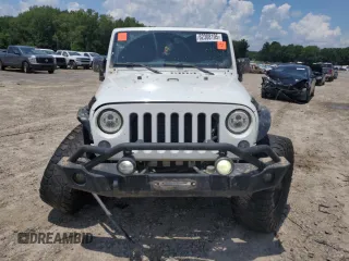 2015 Jeep Wrangler Unlimited Rubicon with VIN 1C4BJWFG6FL710993, listed as a Copart auction lot 62308195 with 103,938 mi miles and Salvage title. Bid and sale history available at DreamBid. Image 5.