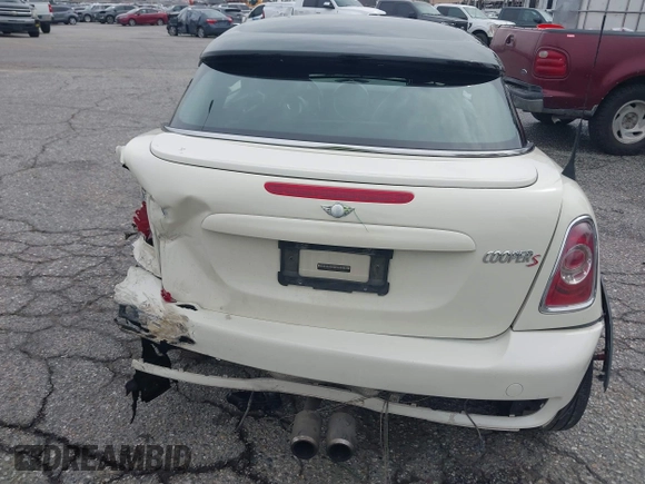 2013 MINI Coupe S with VIN WMWSX3C53DT466648, listed as a IAAI auction lot 41719597 with 106,936 mi miles and . Bid and sale history available at DreamBid. Image 17.