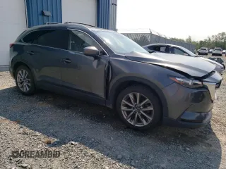 2020 Mazda CX-9 Touring with VIN JM3TCBCY3L0412801, listed as a Copart auction lot 63347355 with 110,374 mi miles and Salvage title. Bid and sale history available at DreamBid. Image 4.