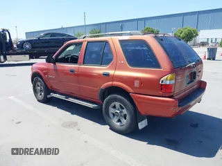 1999 Isuzu Rodeo S z VIN 4S2CK58WXX4346156, wystawiony jako IAAI lot #42328951 z przebiegiem 196 182 mil mil oraz . Historia ofert i sprzedaży dostępna na DreamBid. Obrazek 3.