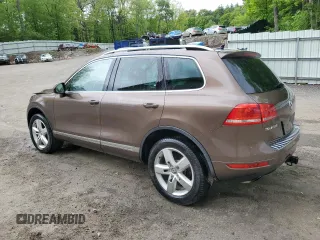 2013 Volkswagen Touareg Exec с VIN WVGEF9BP4DD007109, выставлен на аукционе Copart как лот 58890665 с пробегом 157 286 миль миль и Списание • Salvage title. История ставок и продаж доступна на DreamBid. Изображение 2.
