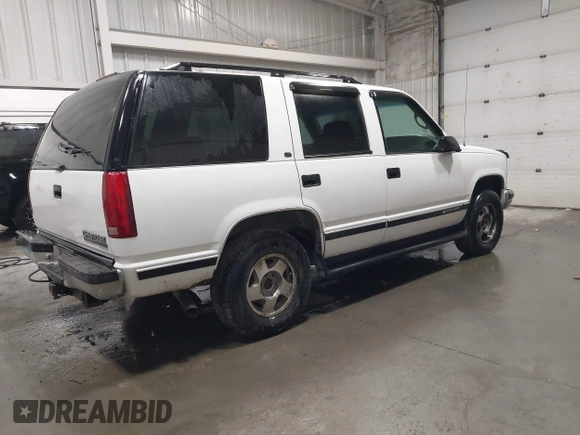 1999 Chevrolet Tahoe Z71 z VIN 1GNEK13R0XJ364222, wystawiony jako IAAI lot #41988710 z przebiegiem 204 577 mil mil oraz . Historia ofert i sprzedaży dostępna na DreamBid. Obrazek 4.
