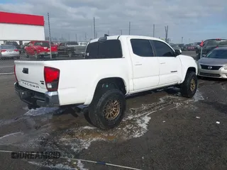 2019 Toyota Tacoma SR z VIN 3TMCZ5AN9KM284092, wystawiony jako IAAI lot #41774851 z przebiegiem 100 031 mil mil oraz . Historia ofert i sprzedaży dostępna na DreamBid. Obrazek 4.