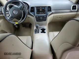 2017 Jeep Grand Cherokee Overland with VIN 1C4RJFCG5HC874130, listed as a Copart auction lot 65324695 with 101,588 mi miles and Salvage title. Bid and sale history available at DreamBid. Image 8.