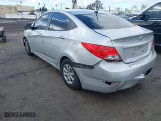 2014 Hyundai Accent GLS with VIN KMHCT4AE6EU613452, listed as a IAAI auction lot 41741747 with 133,672 mi miles. Bid and sale history available at carsss.com. Image 3.