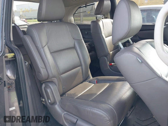 2014 Honda Odyssey Touring with VIN 5FNRL5H99EB111685, listed as a IAAI auction lot 42141227 with 183,484 mi miles and . Bid and sale history available at DreamBid. Image 8.
