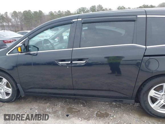 2012 Honda Odyssey Touring with VIN 5FNRL5H96CB058828, listed as a IAAI auction lot 41731389 with 152,295 mi miles and . Bid and sale history available at DreamBid. Image 14.