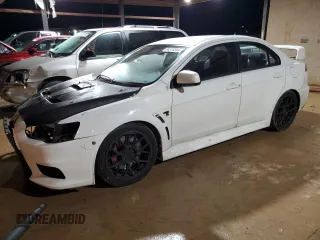 2014 Mitsubishi Lancer Evolution GSR with VIN JA32W8FV1EU024430, listed as a Copart auction lot 84515344 with 117,980 mi miles and Salvage Title. Bid and sale history available at carsss.com. Image 1.